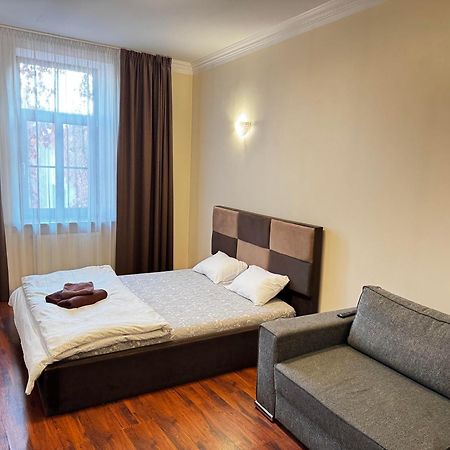 Aparthotel リガ エクステリア 写真 A bedroom in a hotel