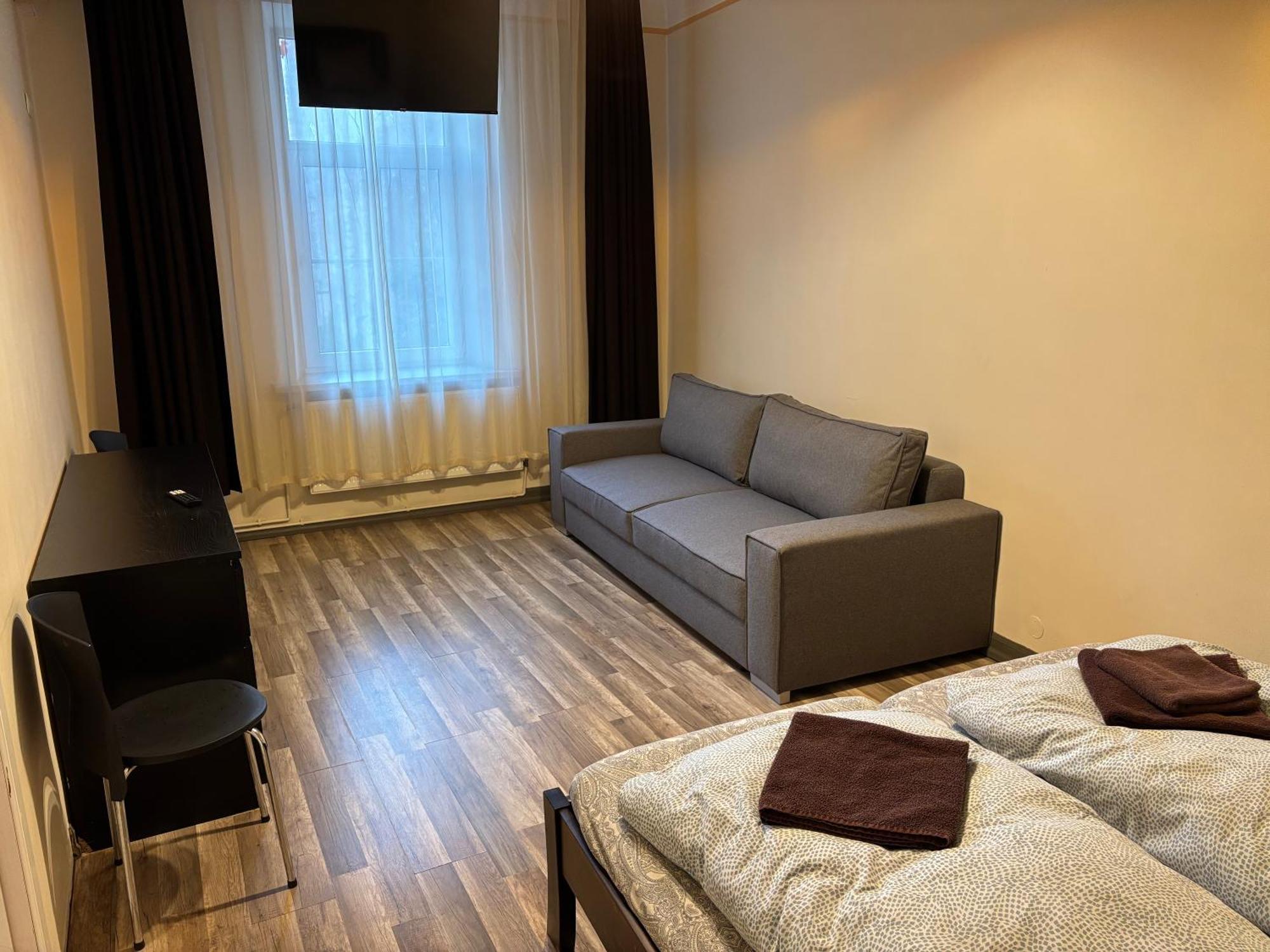 Aparthotel リガ エクステリア 写真 A typical room at the hostel
